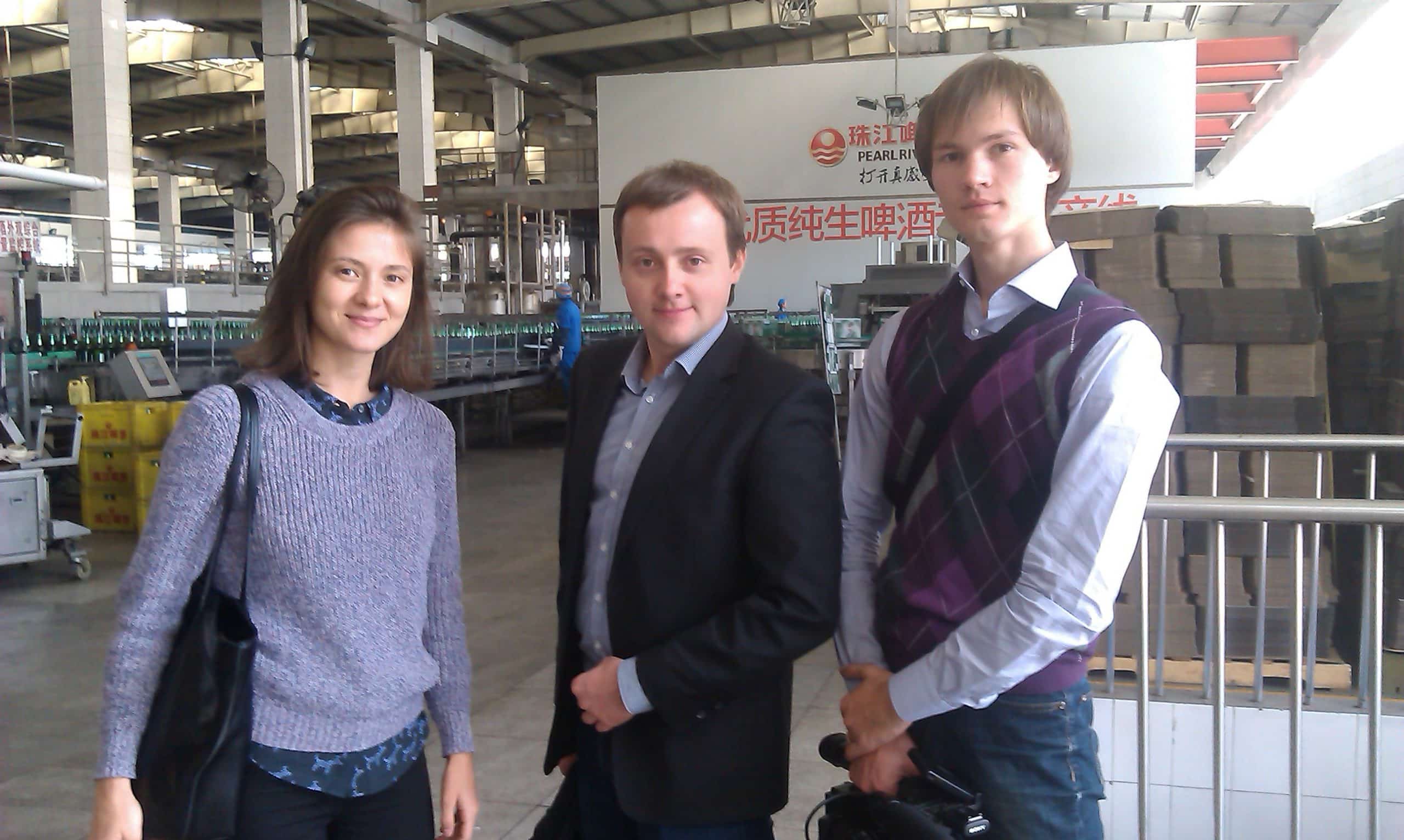 Team at factory visit with client